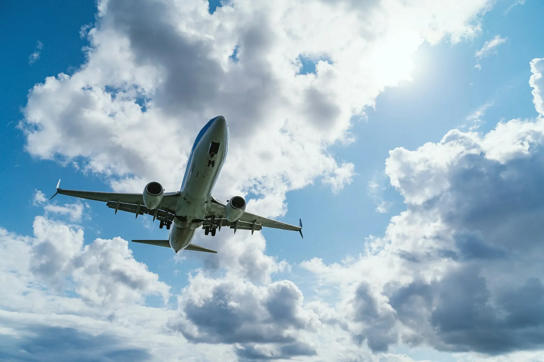 Aircraft climbing through clouds after take-off