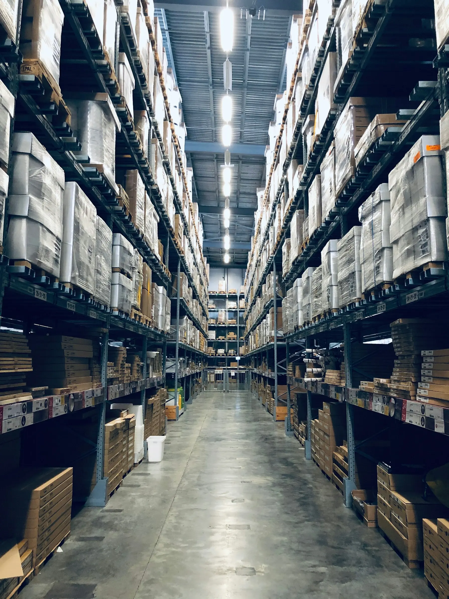 Tall racking aisle inside a modern logistics warehouse